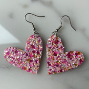 Pink glitter mix hearts by A Glamper’s Creations, LLC featuring sparkling pink heart-shaped confetti for craft or decoration use.