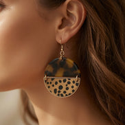 Tortoise and cheetah print dangle earrings by Avenue Zoe with gold hooks, featuring animal print design for stylish accessories