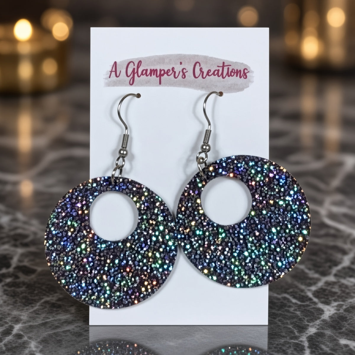Round plum sparkle earrings from A Glamper’s Creations, LLC, featuring shiny, gemstone-like jewelry with a circular design.
