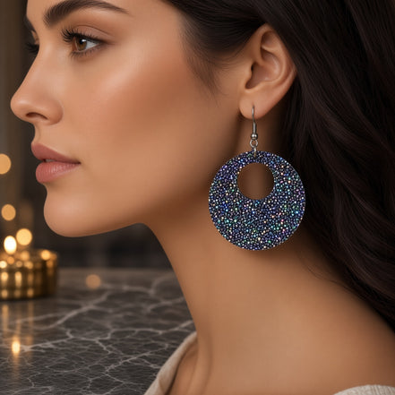 Round plum sparkle earrings from A Glamper’s Creations, LLC, featuring shimmering purple jewelry with a polished, elegant finish.