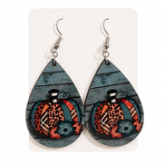 Colorful patterned pumpkin earrings by Earring Babe Boutique, featuring vibrant fall-inspired jewelry design.