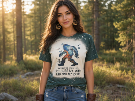 Nwdesigns3 Sasquatch Into the Forest I Go graphic tee, casual top with forest and Sasquatch design on soft fabric.