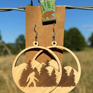 Bigfoot wooden earrings by Krafty Supply featuring carved woodland creature design on natural wood.