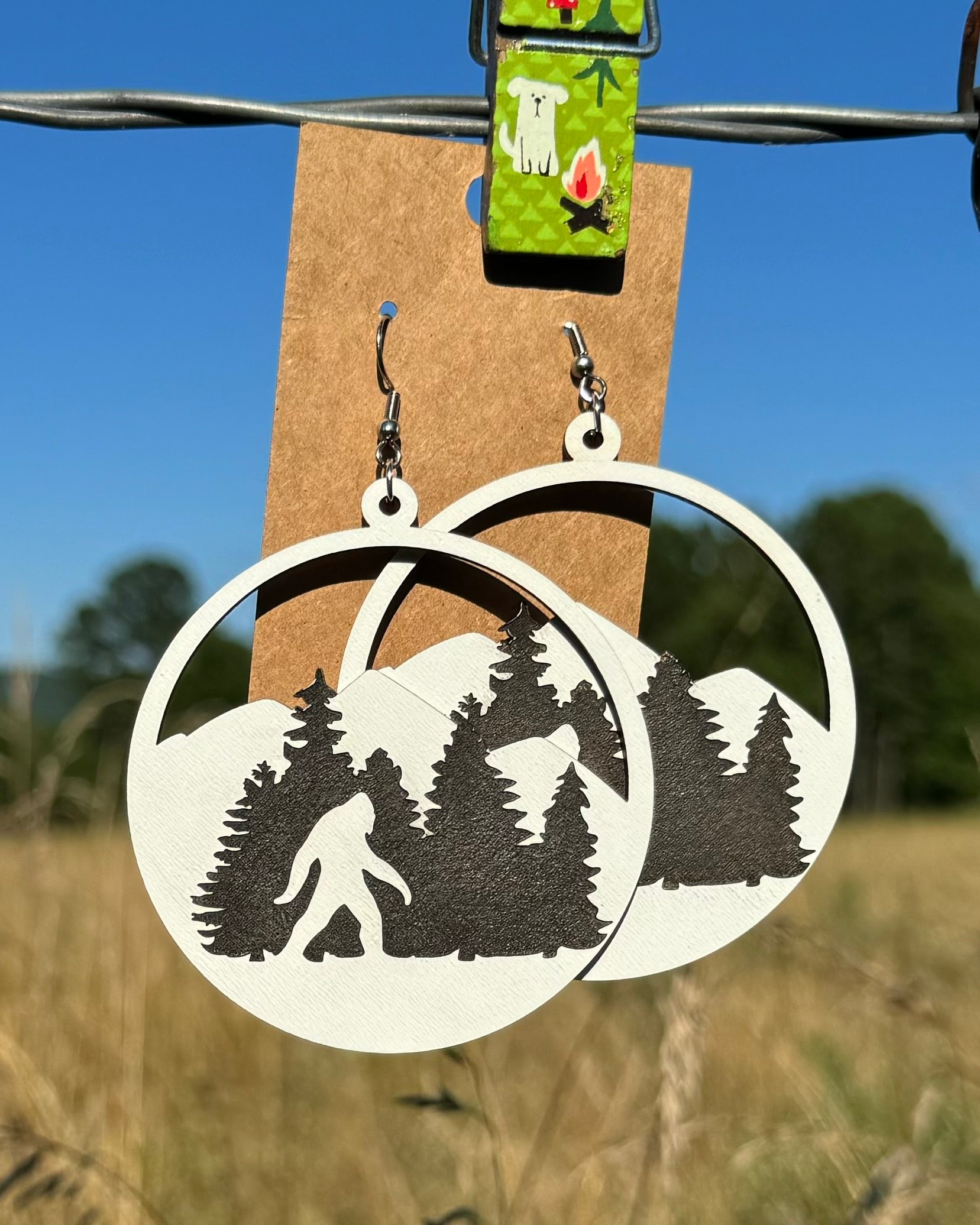 Handcrafted wooden Bigfoot earrings by Krafty Supply featuring detailed, natural wood finish and playful Bigfoot silhouette design.