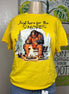 Squatchin’ Country Bigfoot roasting marshmallows graphic T-shirt featuring a Bigfoot figure with marshmallows over a campfire.