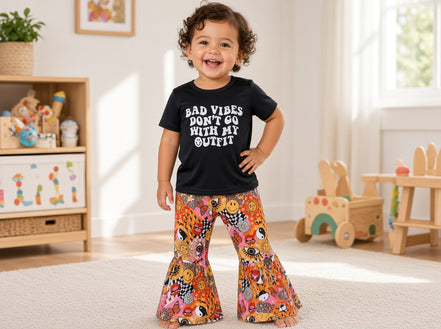 Kids and toddler T-shirt by Yawoo Garments featuring the "Bad Vibes Don’t Go" graphic in bright colors.