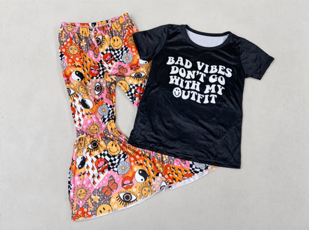 Kids and toddler T-shirt from Yawoo Garments with "Bad Vibes Don’t Go" graphic on soft fabric.