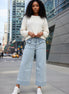 Aapparella wide leg jeans with flap pockets, cuffed hem, and relaxed fit, shown hanging on a white background.