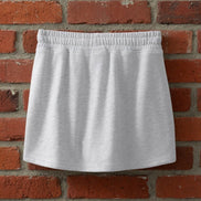 Aapparella mini French Terry skort featuring a comfortable, casual design with a soft fabric and stylish front slit detail.