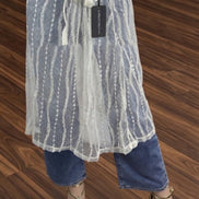 Sheer layered mesh skirt by ADORA LA featuring a flowy, transparent design with multiple mesh layers and a comfortable waistband.