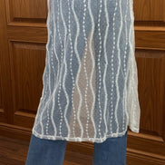 Sheer layered mesh skirt by ADORA LA with flowing, see-through fabric and stylish layered design.