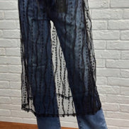 Sheer layered mesh skirt by ADORA LA featuring a lightweight, flowy design with multiple mesh tiers and a stylish, modern look.