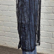 Sheer layered mesh skirt from ADORA LA featuring flowing fabric and stylish design, perfect for fashionable outfits.