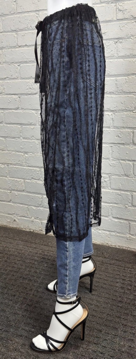 Sheer layered mesh skirt from ADORA LA featuring flowing fabric and stylish design, perfect for fashionable outfits.