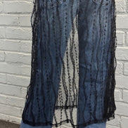 Sheer layered mesh skirt by ADORA LA featuring a flowy, transparent fabric with multiple tiers for a stylish, modern look.