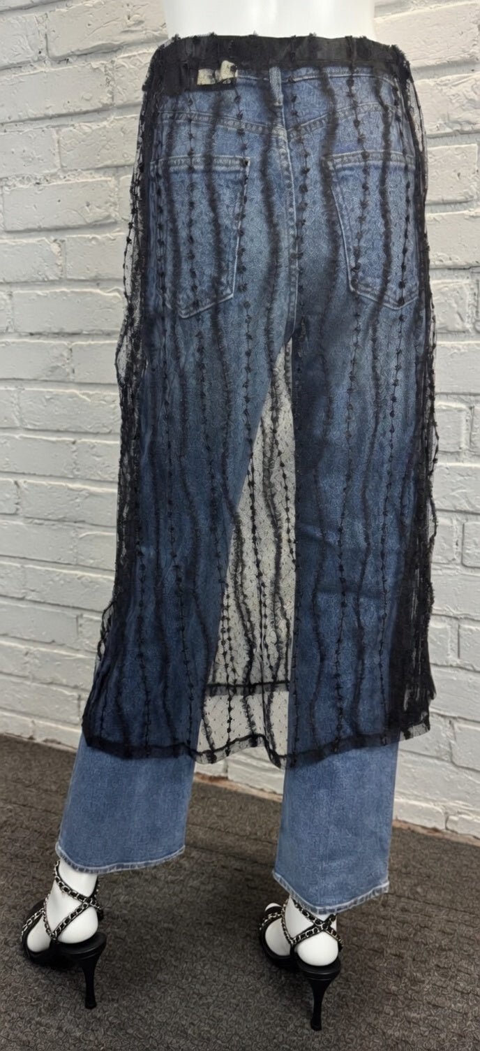 Sheer layered mesh skirt by ADORA LA featuring a flowy, transparent fabric with multiple tiers for a stylish, modern look.