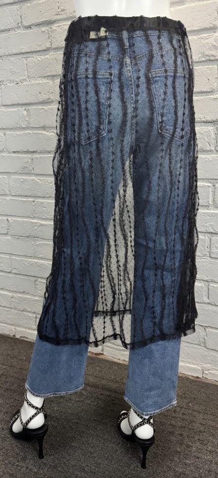 Sheer layered mesh skirt by ADORA LA featuring a flowy, transparent fabric with multiple tiers for a stylish, modern look.