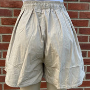 Khaki wide-leg cargo shorts by ADORA LA, featuring a relaxed fit and multiple pockets for a casual, functional style.