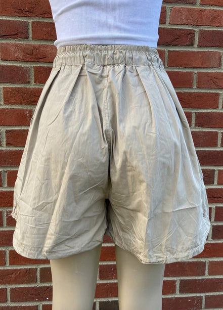 Khaki wide-leg cargo shorts by ADORA LA, featuring a relaxed fit and multiple pockets for a casual, functional style.