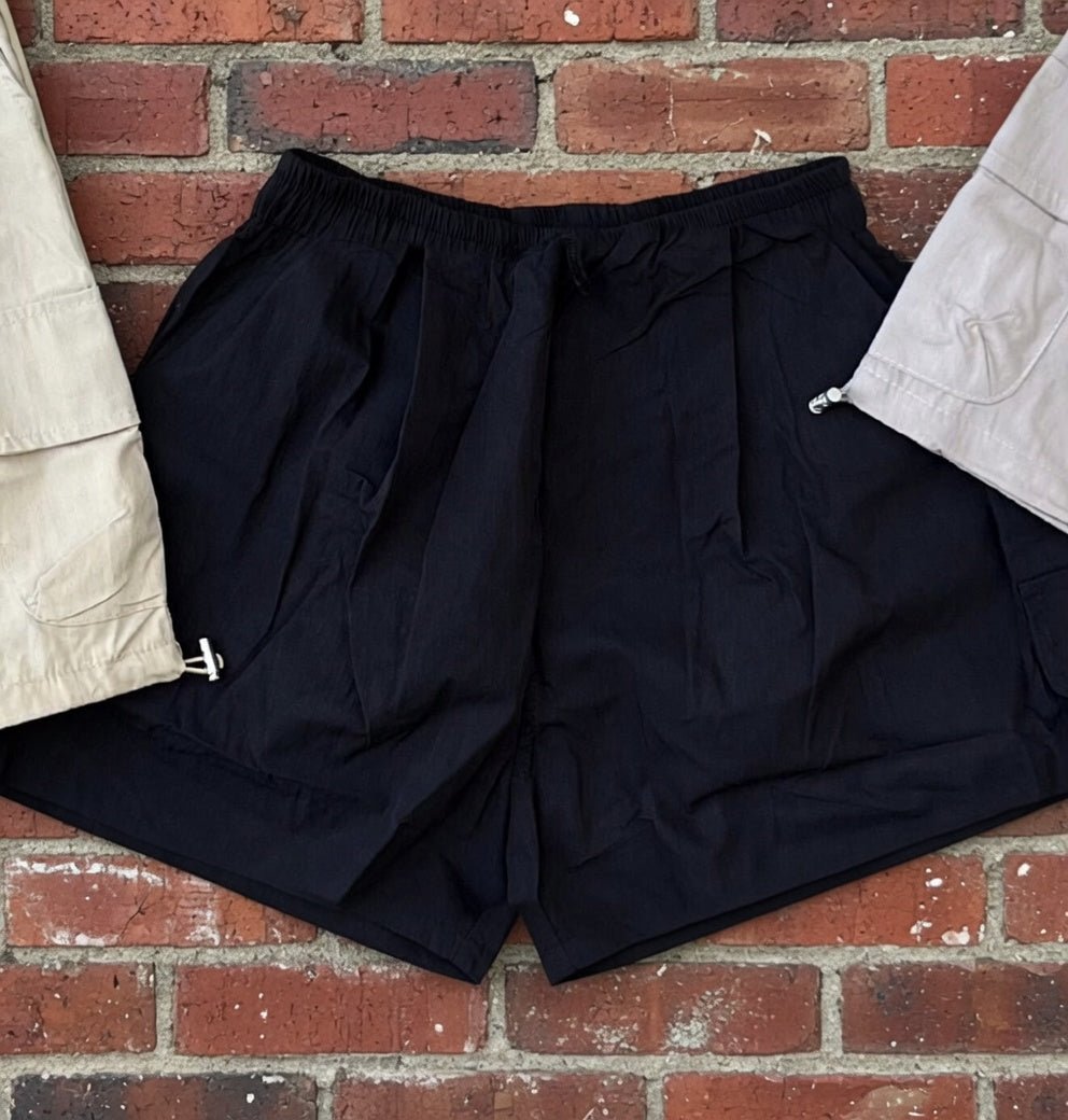 Khaki wide-leg cargo shorts by ADORA LA, featuring relaxed fit, multiple pockets, and casual style for comfortable summer wear.