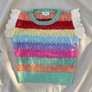 Multi-colored crochet top with eyelet sleeves from ADORA LA, featuring a stylish and vibrant design.