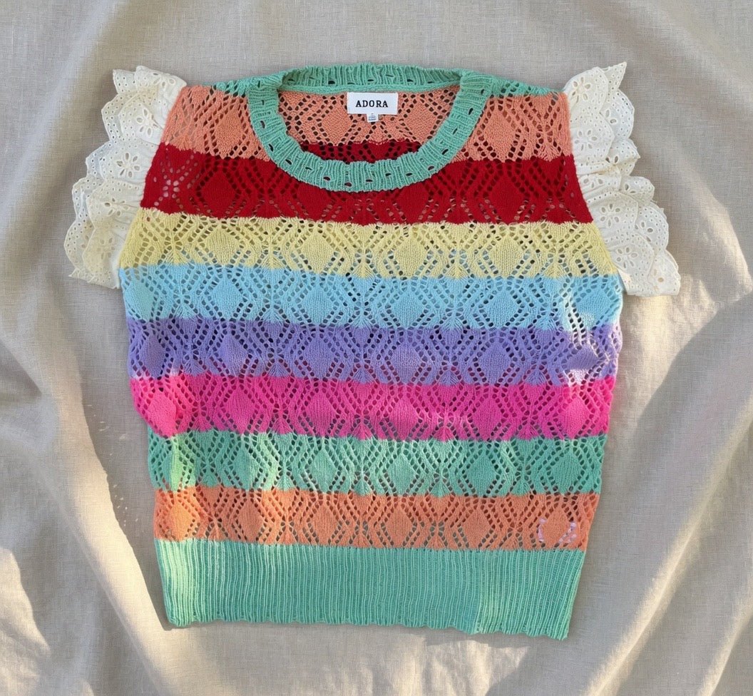 Multi-colored crochet top with eyelet sleeves from ADORA LA, featuring a stylish and vibrant design.
