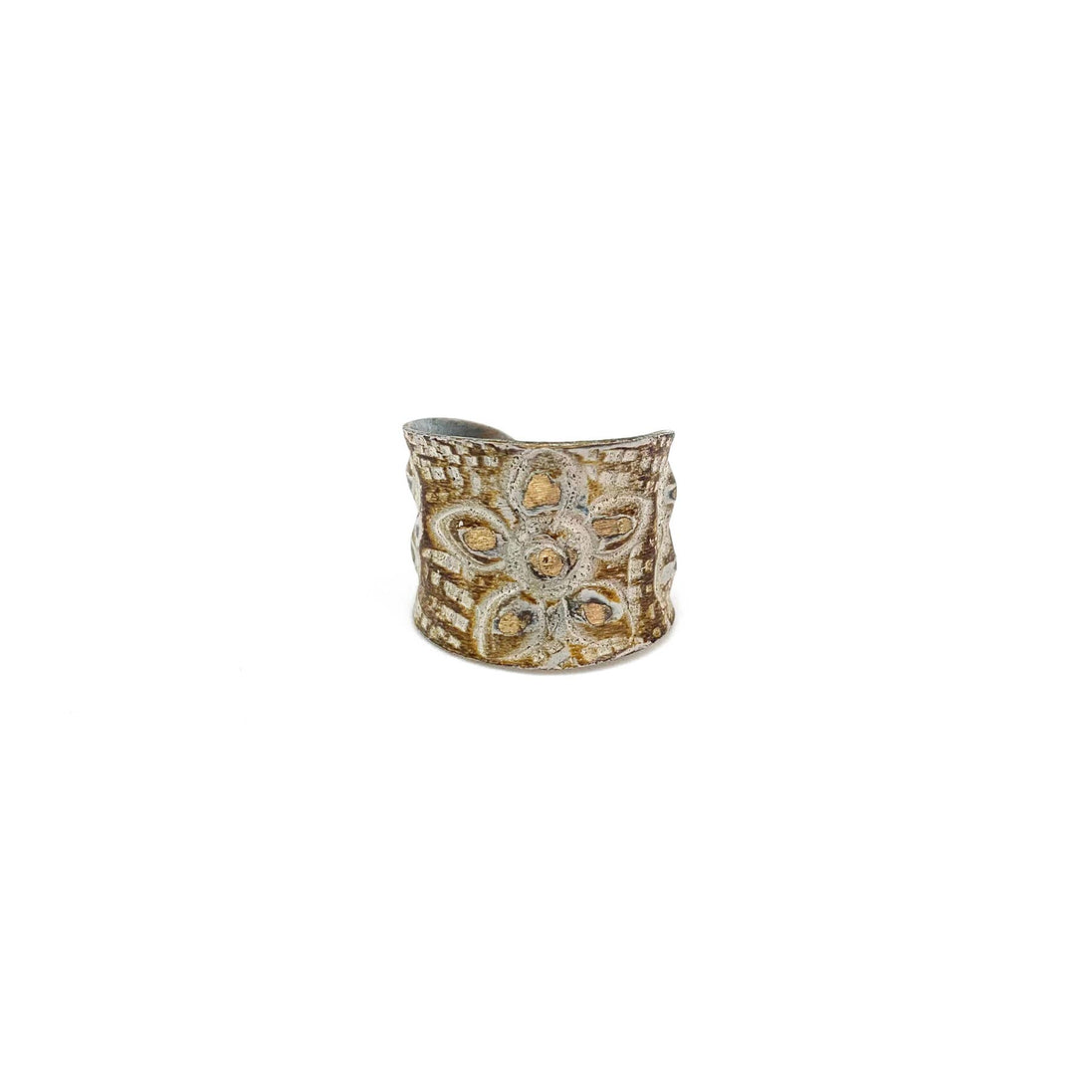 Brass patina ring by Anju Jewelry featuring a large flower design in warm brown and white tones.
