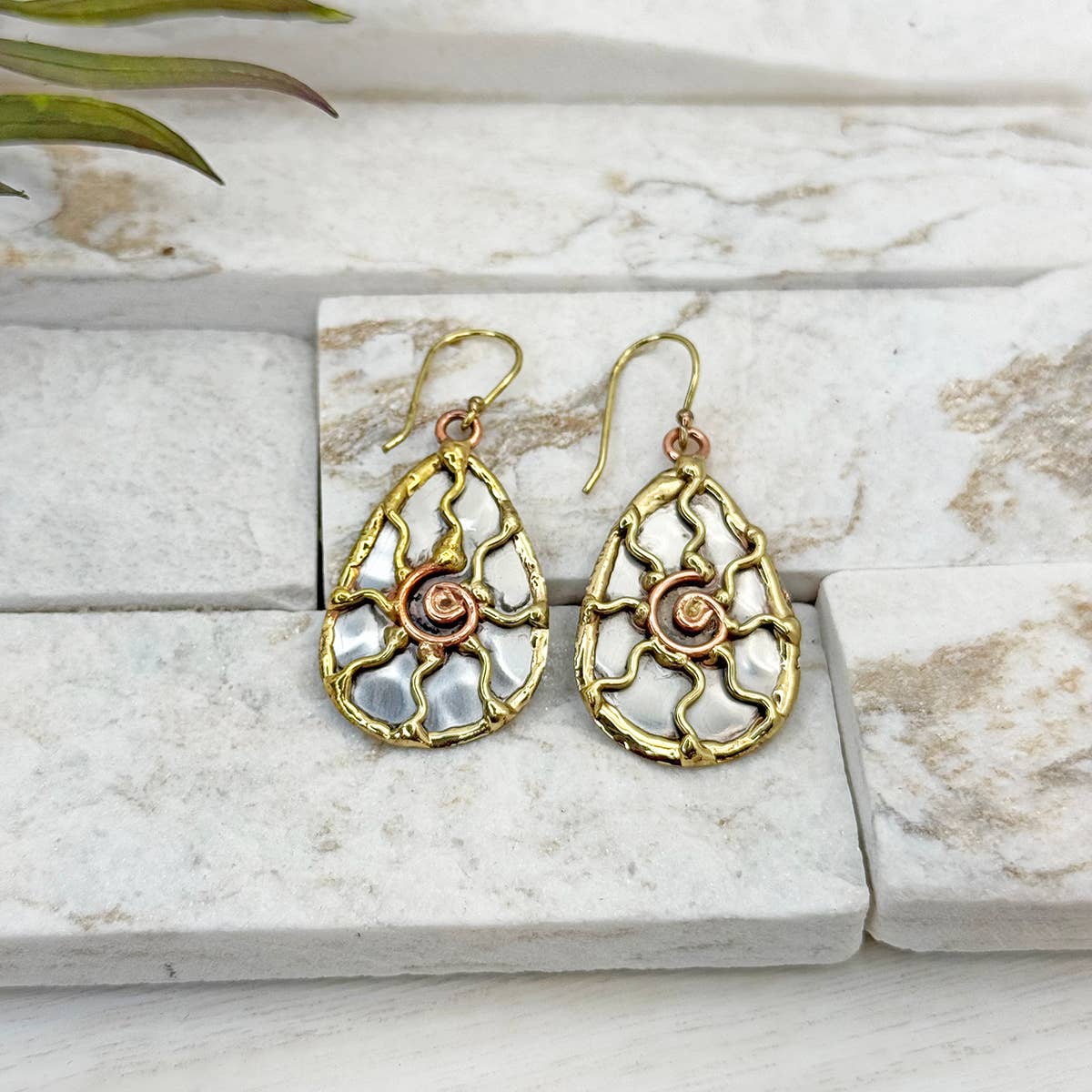 Handcrafted mixed metal sun earrings featuring detailed sunburst design by Anju Jewelry.