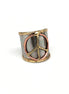 Mixed metal cuff ring by Anju Jewelry featuring a contemporary design with overlapping metal bands and a sleek finish.