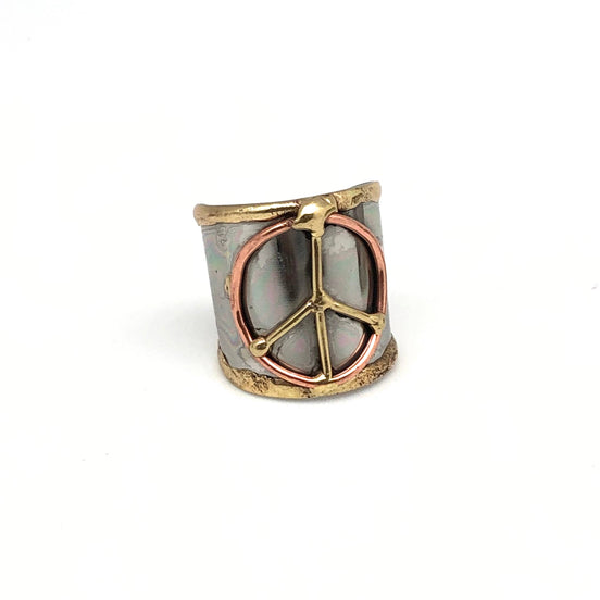 Mixed metal cuff ring by Anju Jewelry featuring a contemporary design with overlapping metal bands and a sleek finish.