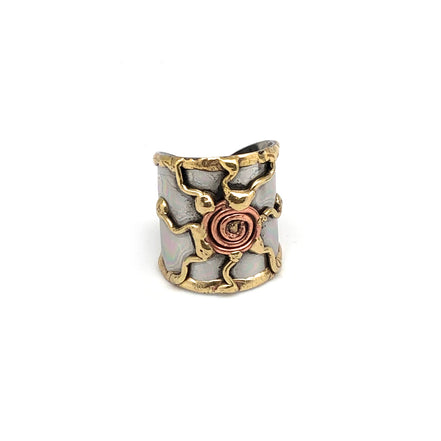 Mixed metal cuff ring by Anju Jewelry featuring a sleek, modern design with overlapping metal bands on a white background.