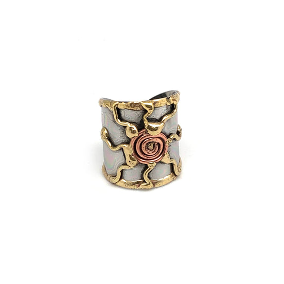 Mixed metal cuff ring by Anju Jewelry featuring a sleek, modern design with overlapping metal bands on a white background.