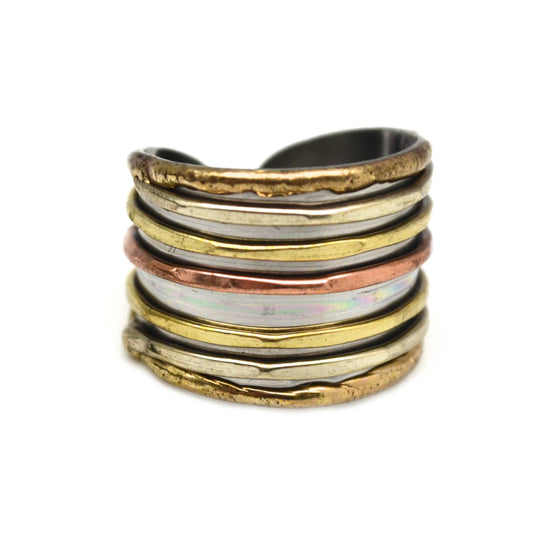 Mixed metal cuff ring by Anju Jewelry, showcasing a stylish jewelry piece with a combination of silver and gold tones.