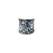 Silver patina ring by Anju Jewelry featuring a blue small floral design, showcasing intricate jewelry craftsmanship.