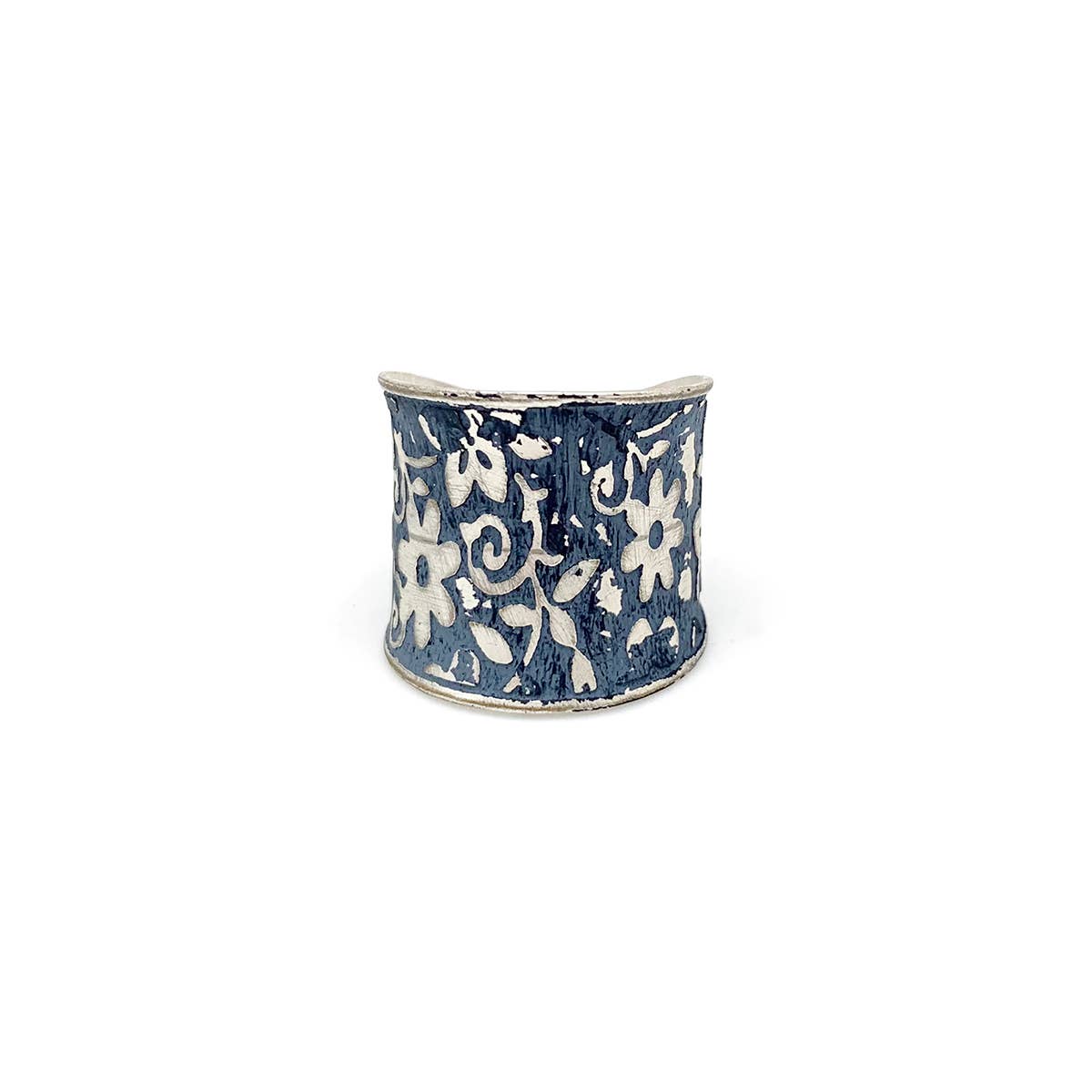 Silver patina ring by Anju Jewelry featuring a blue small floral design, showcasing intricate jewelry craftsmanship.