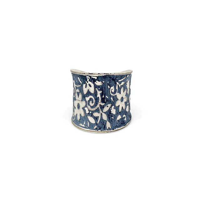 Silver patina ring by Anju Jewelry featuring a blue small floral design, showcasing intricate jewelry craftsmanship.
