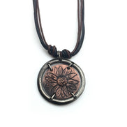 Gold sunflower in circle pendant necklace by Anju Jewelry, featuring intricate floral design, on a delicate chain.
