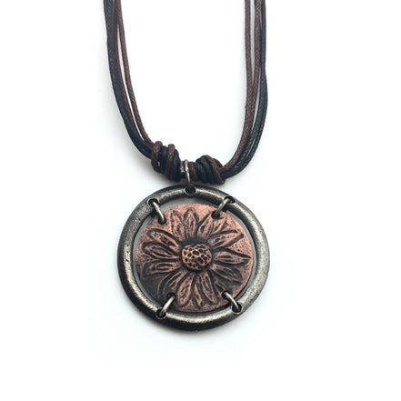 Gold sunflower in circle pendant necklace by Anju Jewelry, featuring intricate floral design, on a delicate chain.