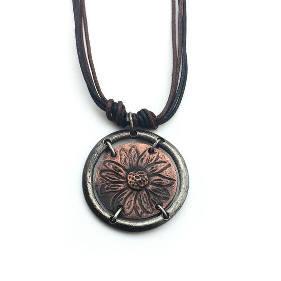 Gold sunflower in circle pendant necklace by Anju Jewelry, featuring intricate floral design, on a delicate chain.