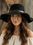 Avenue Zoe boho black felt hat with wide brim and decorative band, stylish accessory for fashion-forward outfits.