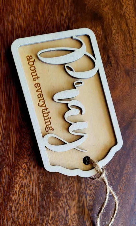 Wooden "Pray About Everything" sign by The Country Roost with rustic finish, featuring inspirational quote in elegant lettering.