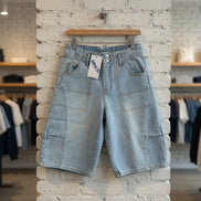 Blue B cargo denim knee-length shorts with functional pockets and a casual fit, ideal for comfortable summer wear.