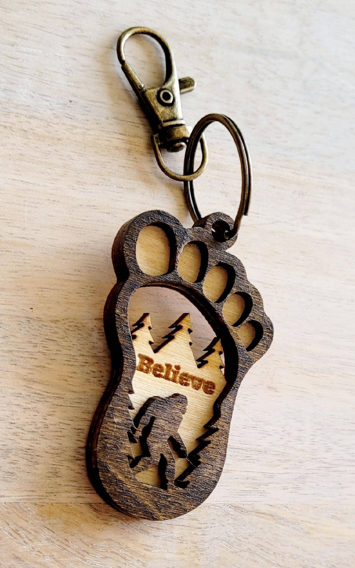 Big Foot keychain featuring a detailed Sasquatch figure, attached to a metal keyring, by The Country Roost.