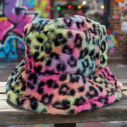 Tie dye leopard patterned faux fur bucket hat by Cap Zone with vibrant, bold animal print and soft fur texture.