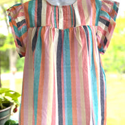 Spring Stripes shirt by Crossed Arrows Clothing Co featuring a vibrant striped pattern and casual fit.