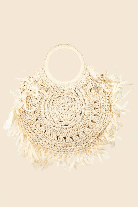Straw braided fringe bag by Anarchy Street featuring boho style with woven straw texture and long fringe detailing.