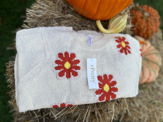 Floral knit cropped sweater from ePretty, featuring colorful floral patterns and a cozy, stylish design for casual wear.