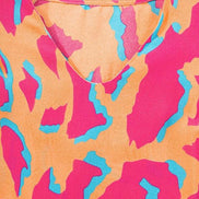 Abstract V-neck blouse with ruffled sleeves from Little Daisy Closet, stylish top featuring a flowy, feminine design.