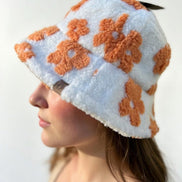 Green floral sherpa bucket hat by Fashion City with a cozy, textured fabric and wide brim for a casual, stylish look.