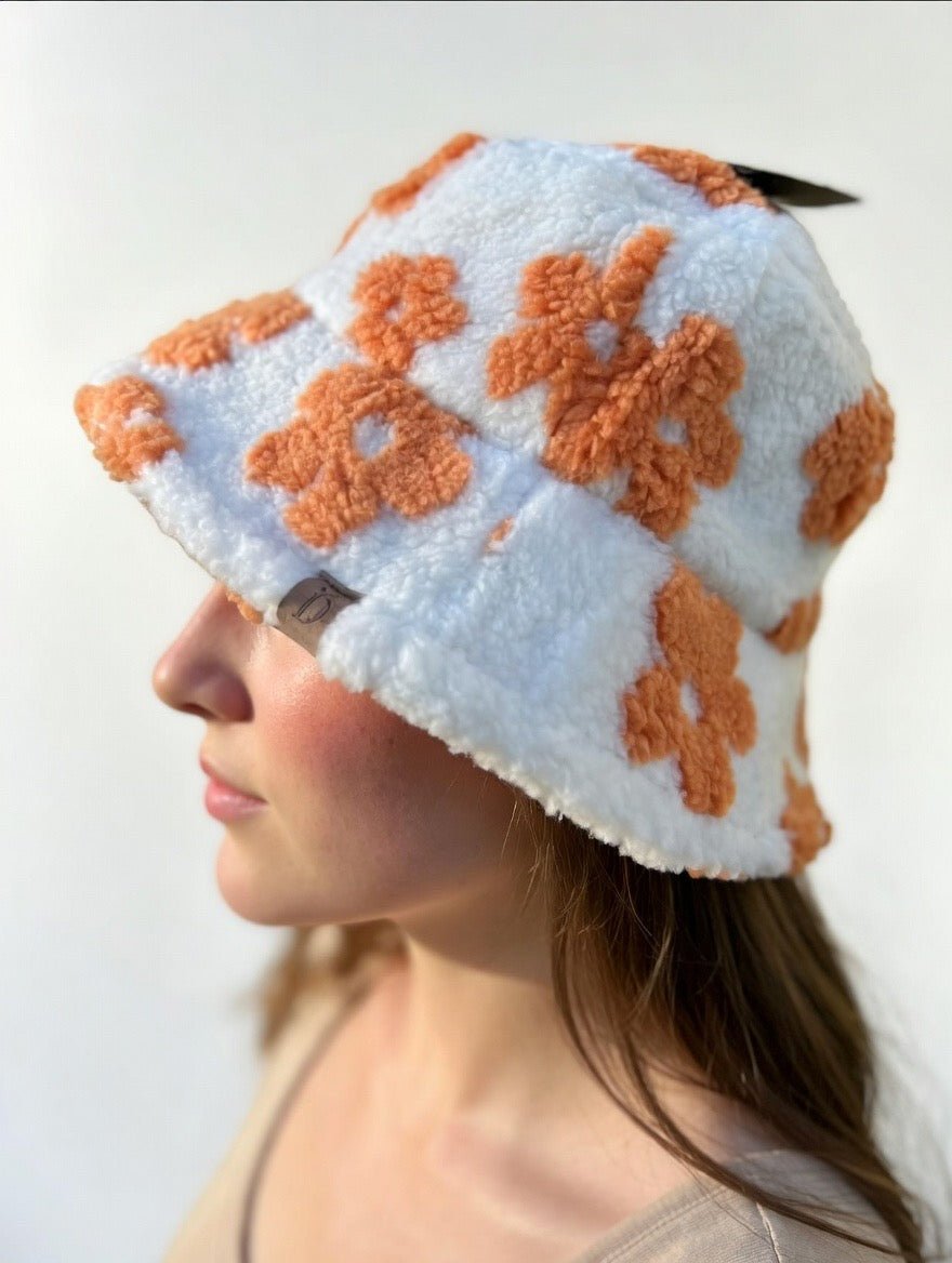 Green floral sherpa bucket hat by Fashion City with a cozy, textured fabric and wide brim for a casual, stylish look.